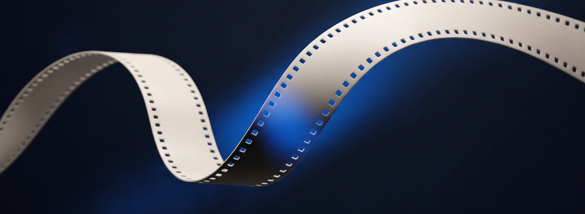 A single strip of film curving through navy space, one cobalt light running through the sprocket holes